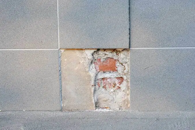 Damaged bathroom floor tiles