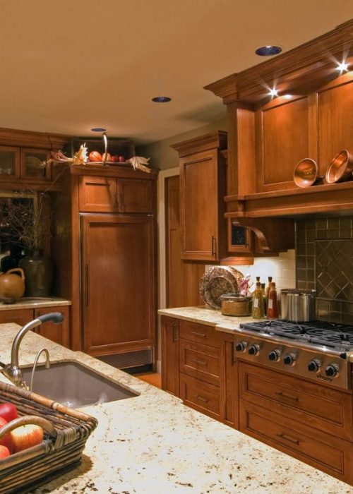 Kitchen with Island, Sink, Cabinets, and Hardwood Floors